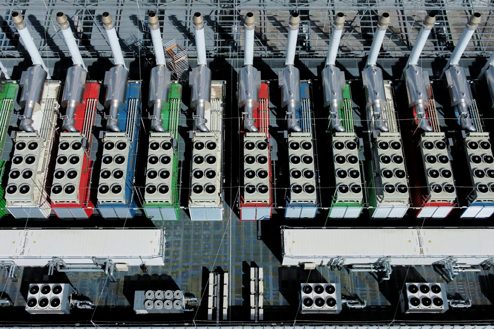chillers on the roof of a data center from above, work to cool the equipment inside the building.