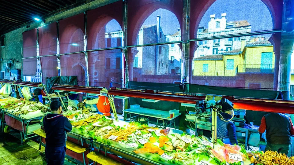 Venice, Italy - March 12: famous Mercato di Rialto - fish- and farmers-market near the rialto bride in venice on March 12, 2019