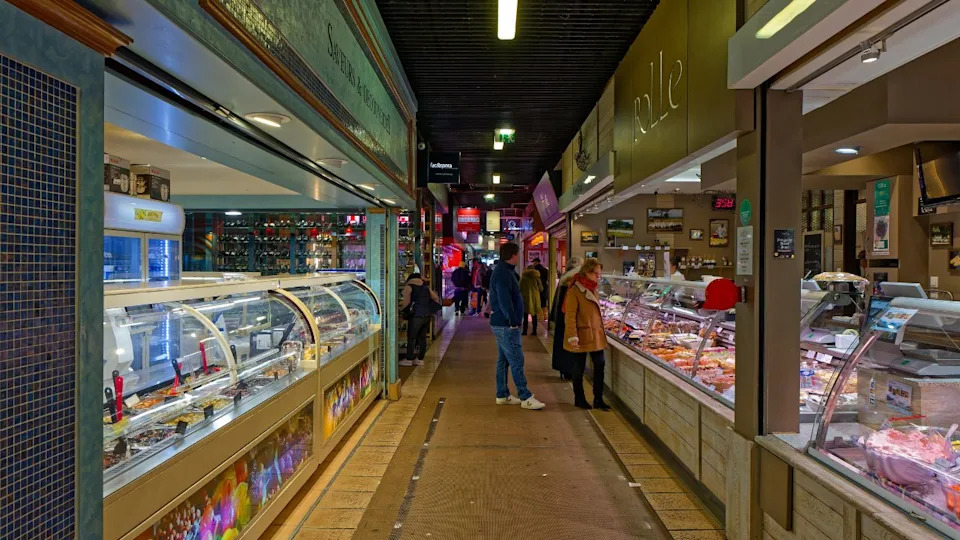 LYON, FRANCE, February 14, 2025 : Shops of famous traditional cuisine in Les Halles de Lyon, which bear the name of the famous chef Paul Bocuse
