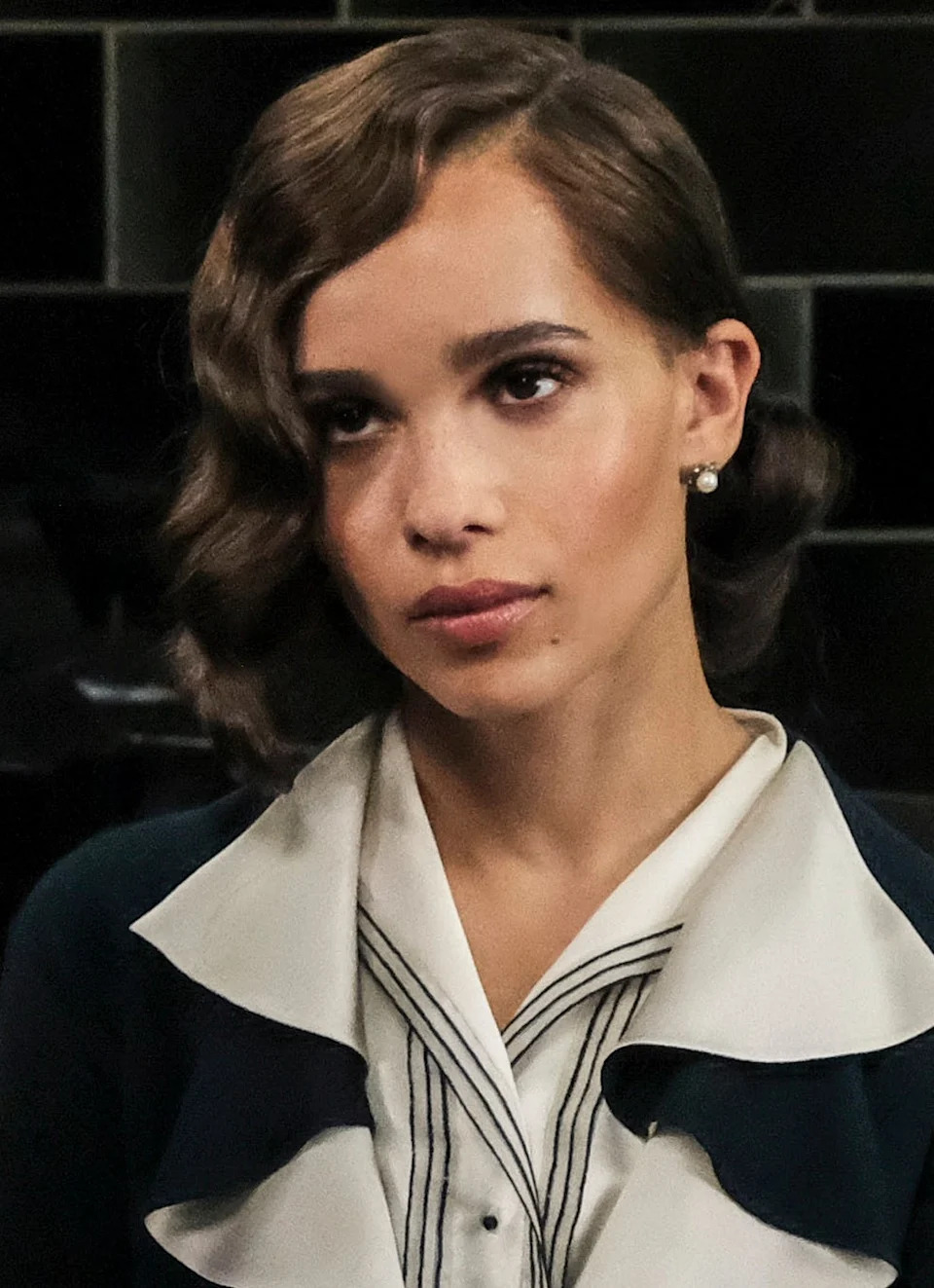 Zoë Kravitz dressed in vintage clothing with striped detailing