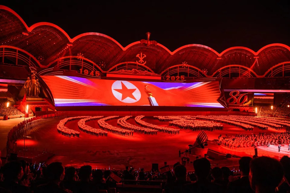 Participants take part in the ‘Long Live the Workers’ Party of Korea’ performance to celebrate the 80th founding anniversary of the Workers’ Party of Korea at the May Day Stadium in Pyongyang on 9 October 2025 (AFP via Getty Images)