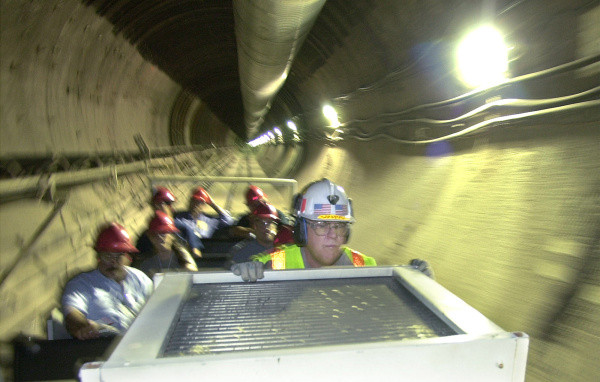 Brakeman Leonard Jacobson watches the tunnel as a train with the media tours the proposed Yucca Mountain nuclear waste dump near Mercury, Nev. (AP Photo/Joe Cavaretta)