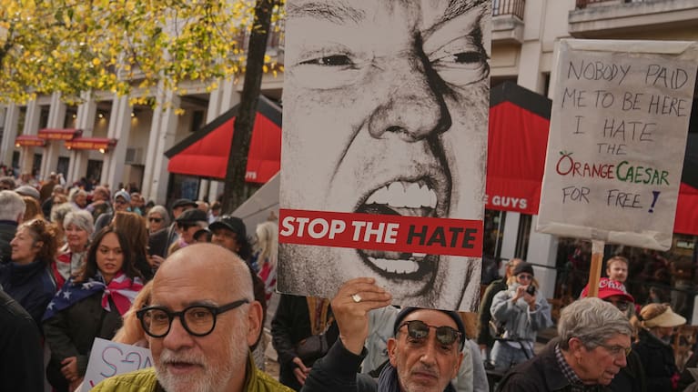 People attend a protest against US President Donald Trump, in Paris, Saturday, Oct. 18, 2025