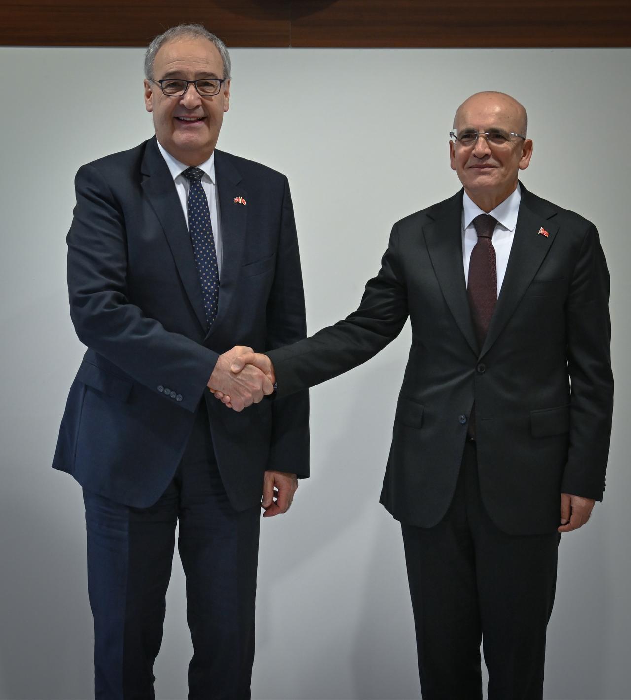 Türkiye’s Treasury and Finance Minister Mehmet Simsek (right) shakes hands with Swiss Vice President and Minister of Economic Affairs, Education, and Research Guy Parmelin (left) during their meeting in Ankara, Türkiye, October 30, 2025. (AA Photo)