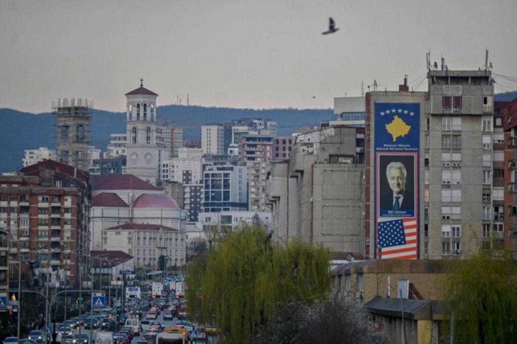 This photo shows a big banner depicting a portrait of former U.S. President Bill Clinton along with United States and Kosovo flags in Pristina, Kosovo, on March 22, 2024. (AFP Photo)