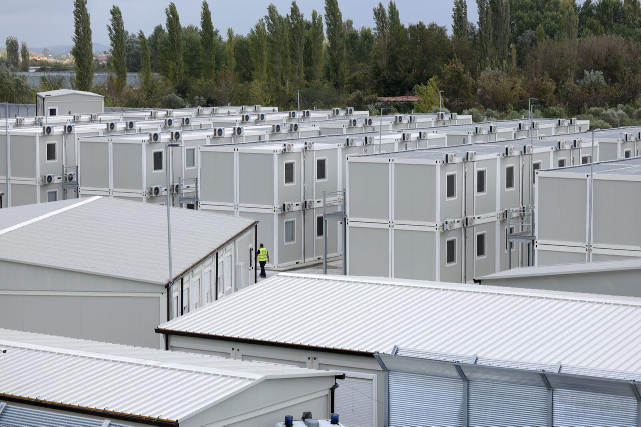 An Italian security personel walks inside a recently build Italian-run migrant centre at the port of Shengjin, some 60 kms northwest of Tirana, Albania on Oct. 11, 2024. (AFP Photo)