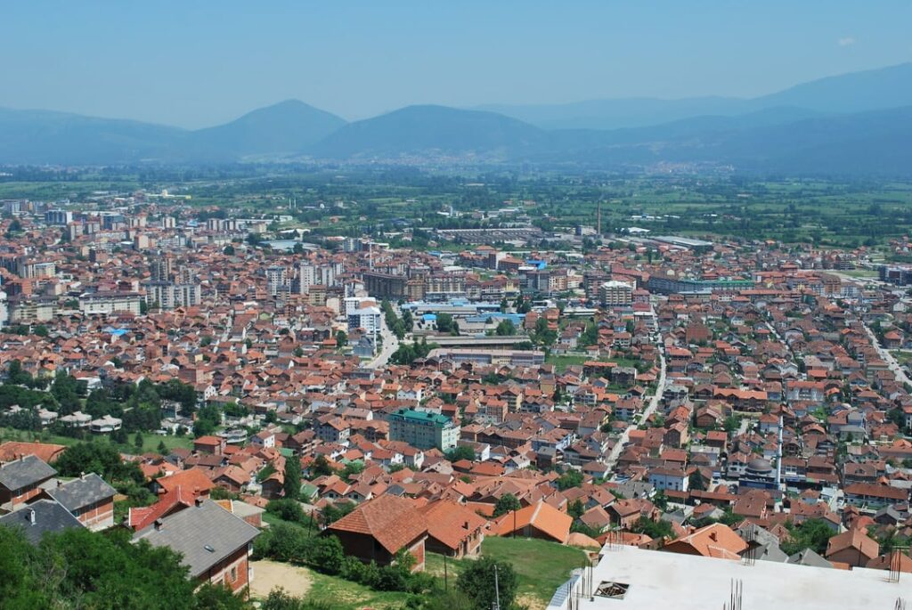 Which two cities are in this picture, and which one is better?