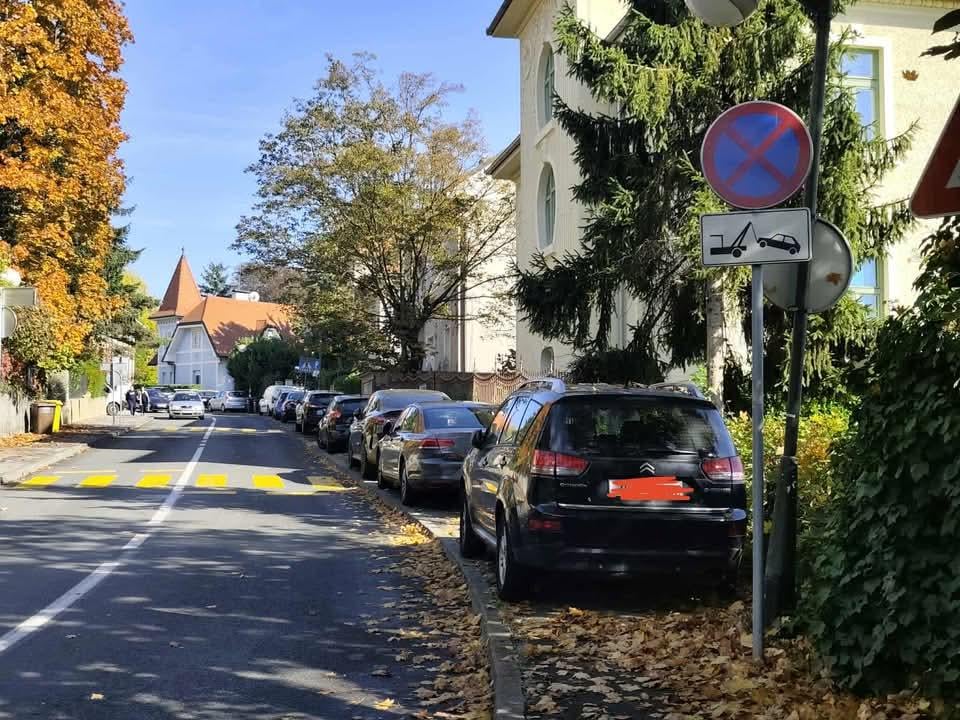 Zagreb ironies. Sidewalk = free parking. No parking sign = I don't understand