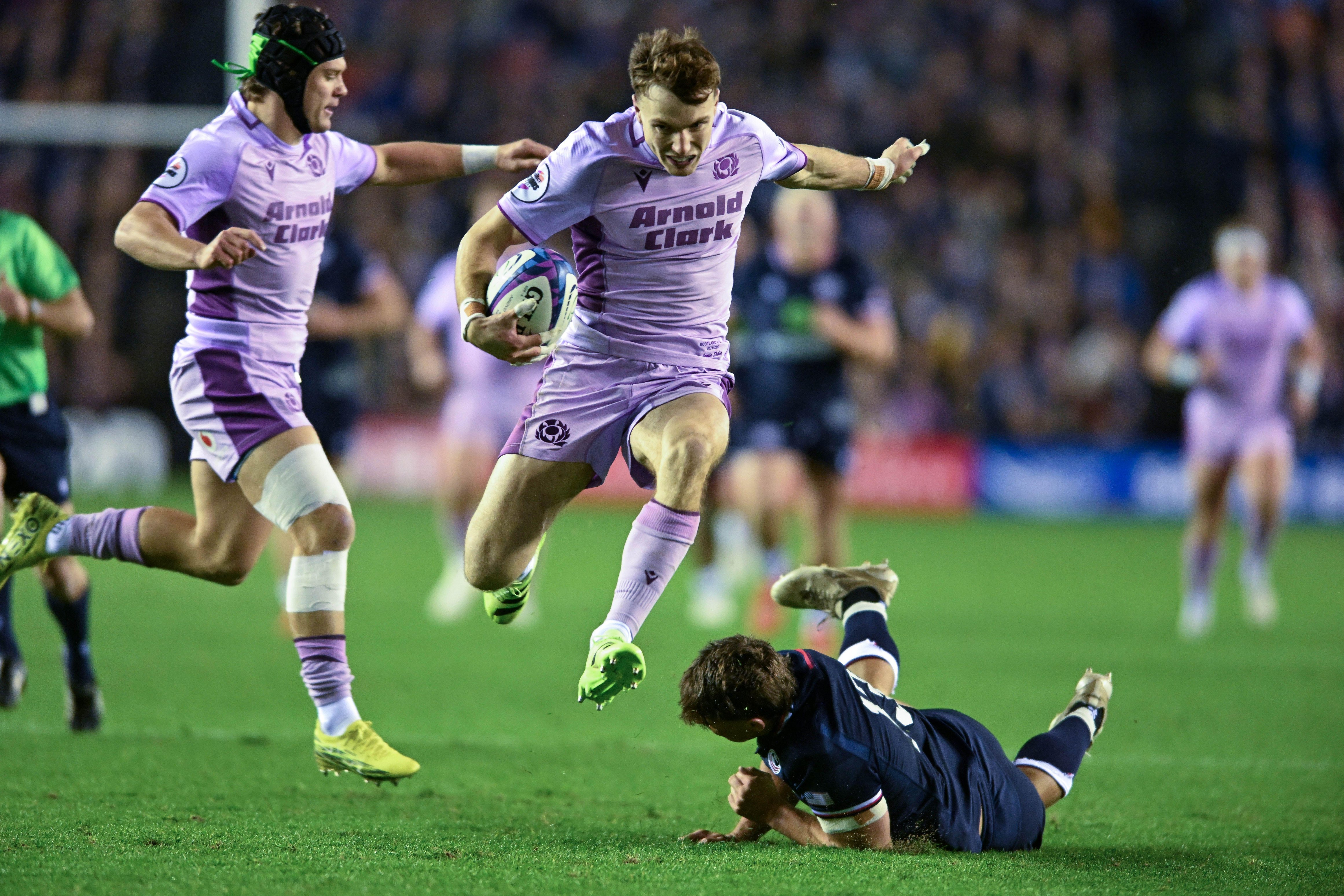 Edinburgh, UK. 1st Nov, 2025. Jamie Dobie of Scotland breaks the tackle of Dominic Besag of United States to score a try during the Scotland vs USA Autumn Nation Series match at Murrayfield Stadium, Edinburgh. Picture credit should read: Neil Hanna/S