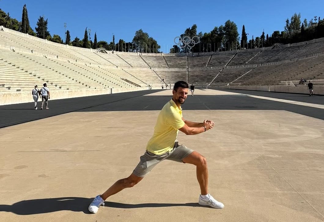 Novak Djokovic stretches in the Panathenaic Olympic Stadium.