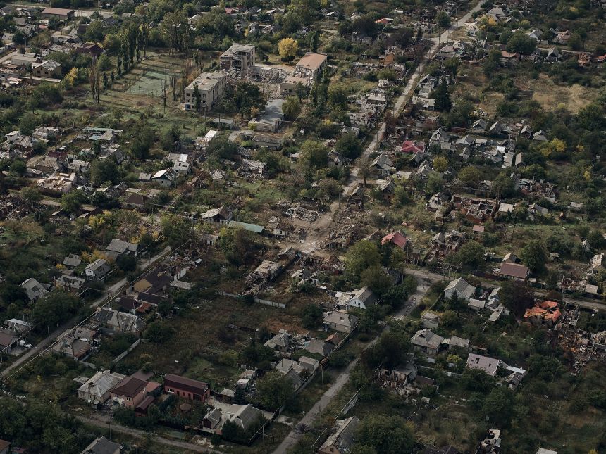 An aerial view shows the destroyed city of Pokrovsk covered in morning fog, following months of intense fighting, on October 7, 2025.
