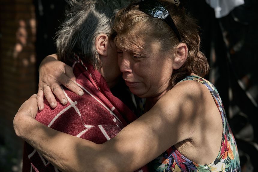 A mother and daughter say goodbye to each other as civilians are evacuated from Pokrovsk by forces of the National Police of Ukraine, known as 