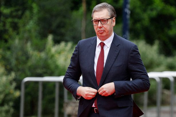 Serbia's President Aleksandar Vucic walking