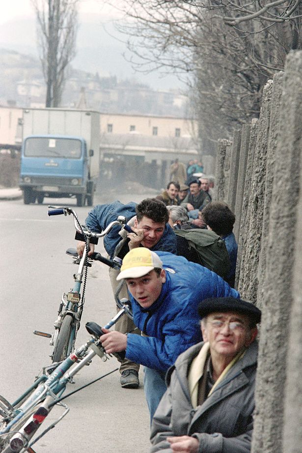 Civilians in Sarajevo hiding from snipers in 1993