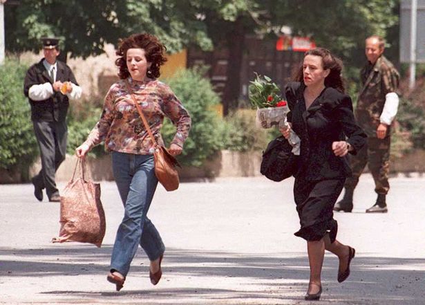 Two women running from snipers
