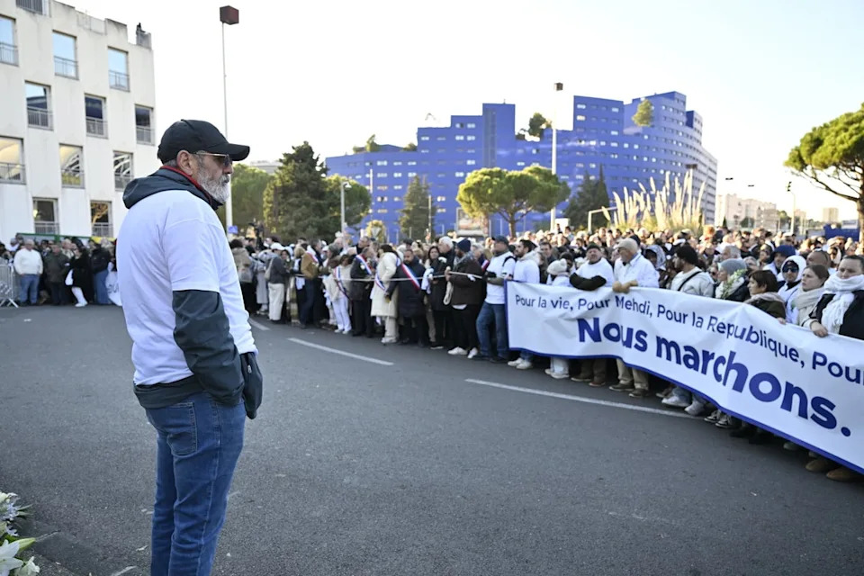 The father of Mehdi Kessaci attends the gathering homage to his son Mehdi at the roundabout where he was murdered, and to protest against drug trafficking in Marseille, southern France, Saturday, Nov. 22, 2025. (AP Photo/Philippe Magoni) (Copyright 2025 The Associated Press. All rights reserved)