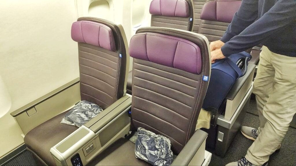United Airlines Premium Economy seats to Hawaii showing purple headrests and extra legroom.