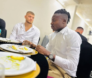 Salifu Ibrahim at a restaurant in Kosovo