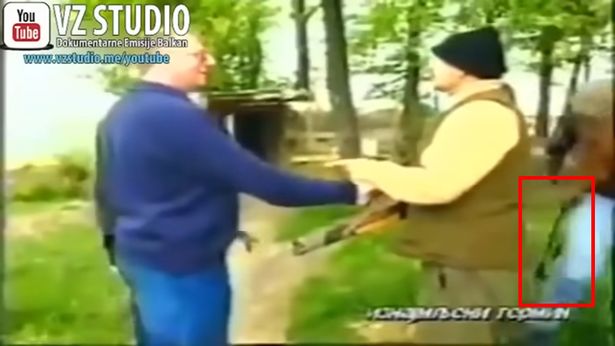 Vucic holding something in his hand