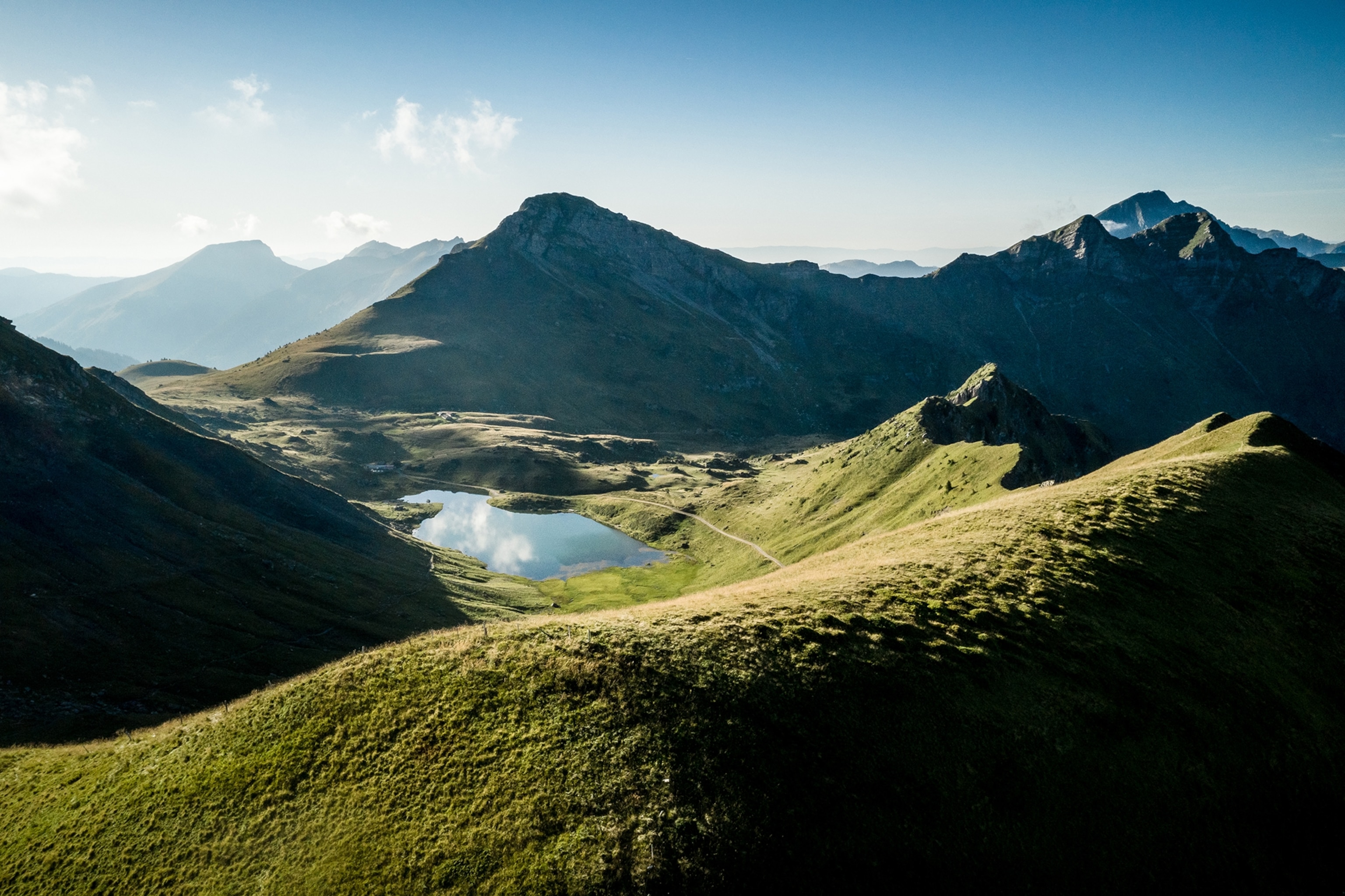 The calm Lac Vert sits among the mountain peaks of the Dents du Midi region of Valais.