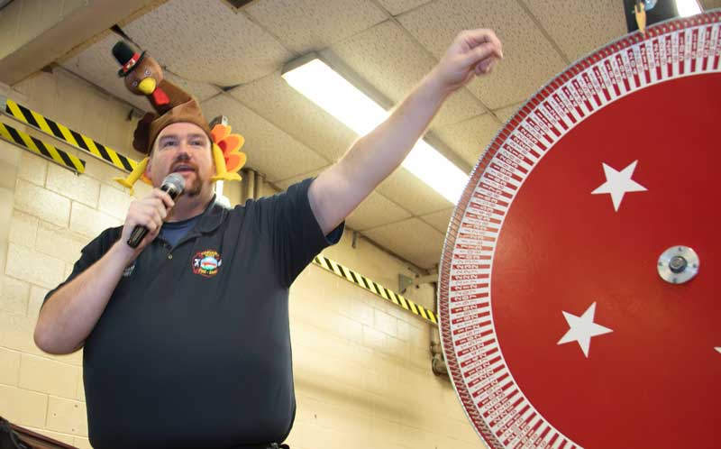 ‘A turkey and a bag of apples!’ calls Perry, MC at...