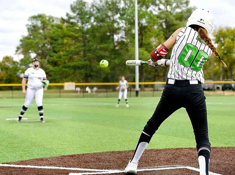 Southern Flex's Gemma Bryan connects with a pitch for a base hit against the Black Sox, of Bossier City, La., on Dave Hall Field in a 14U game of the Turkey Trot on Turf tournament Sunday, Nov. 16, 2025, at the Swanger Complex in Texarkana, Texas. The Southern Flex are from Emerson, Ark. (Staff photo by Stevon Gamble)