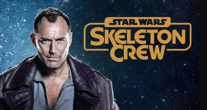 Actor in rugged outfit stands in front of a starry background, with text "Star Wars Skeleton Crew" beside him