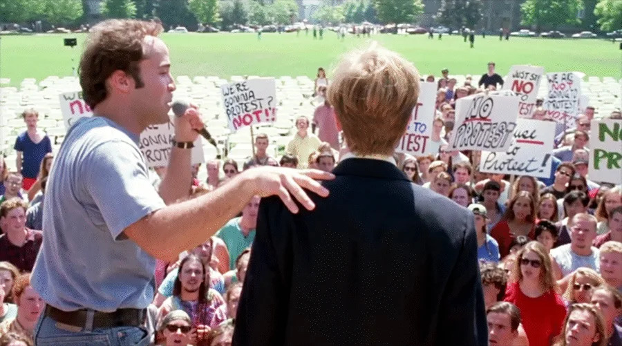 Droz taking no guff from Rand McPherson (David Spade) in <em>PCU</em> (1994)