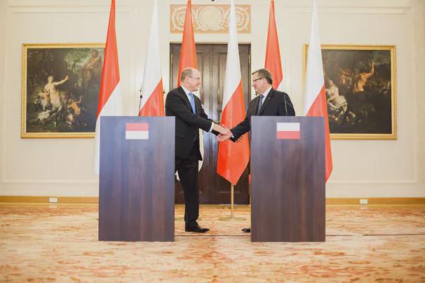 Albert II in Poland in 2012. I am sure they just printed the polish flag and turned it down :)