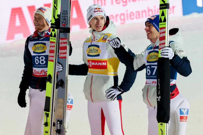 Austria's winner Daniel Tschofenig, second-placed Jan Hoerl, and third-placed Stefan Kraft celebrate after the men's season opener event of the FIS Ski Jumping World Cup in Lillehammer. Geir Olsen/NTB/dpa