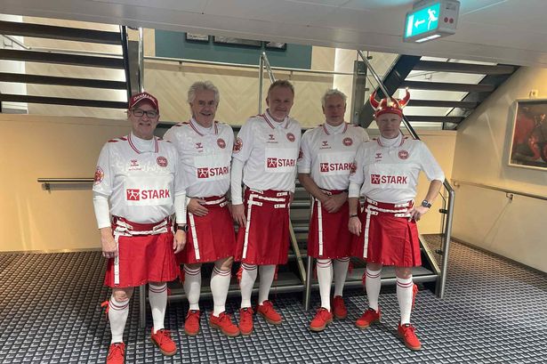 Denmark fans in their special red kilts head to Scotland for the 'winner takes all' World Cup match