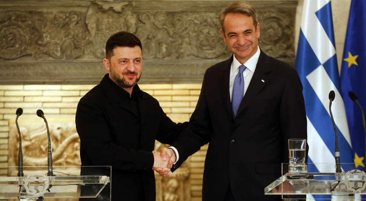 Ukrainian President Volodymyr Zelensky shakes hands with Greek Prime Minister Kyriakos Mitsotakis during a visit to Athens on Sunday, Nov. 16, 2025.