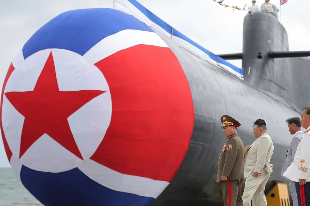 North Korean leader Kim Jong-un (second from left) inspects what state media described as a new nuclear attack submarine in 2023. Photo: KCNA/KNS/AP North Korean leader Kim Jong-un (second from left) inspects what state media described as a new nuclear attack submarine in 2023. Photo: KCNA/KNS/AP
