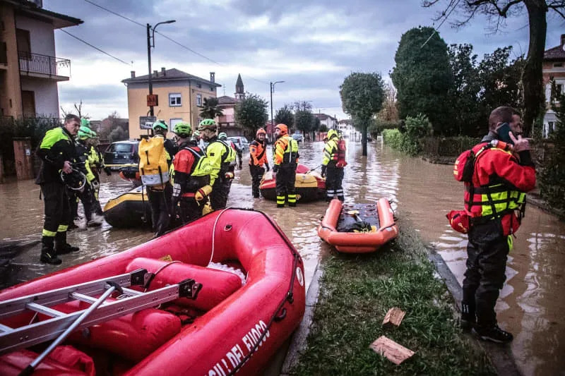 Rescue workers are deployed with rubber dinghies during flooding after storms in northern Italy. Michela Porta/IPA via ZUMA Press/dpa