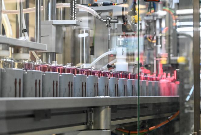 Perfume bottles on a production line at L'Oréal's Gauchy plant, December 11, 2020.