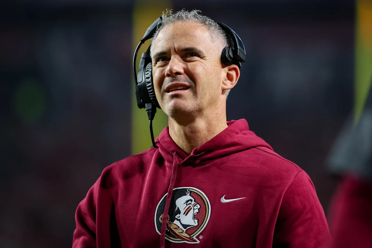 RALEIGH, NORTH CAROLINA - NOVEMBER 21: Head Coach Mike Norvell of the Florida State Seminoles looks on during the first half of a football game against the NC State Wolfpack at Carter-Finley Stadium on November 21, 2025 in Raleigh, North Carolina. (Photo by David Jensen/Getty Images)