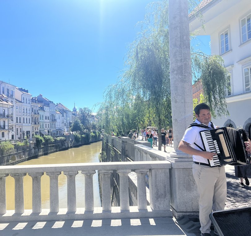 A busker by the river. 