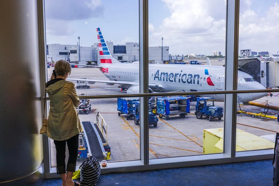 Fares on major US routes have fallen by up to seven percent. Pictured is an American Airlines' plane at Miami International (Getty Images)