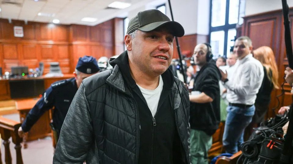 Ukrainian diver Volodymyr Zhuravlyov walks free from court after a judge denied Germany's extradition request and lifted his pretrial detention at the district court in Warsaw, Poland, October 17, 2025. - Omar Marques/Getty Images