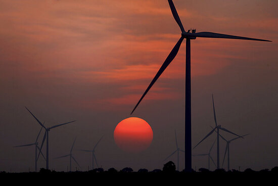 File - The sun sets at wind farm in McCook, Texas during a heat wave on Wednesday, July 20, 2022. House Republicans voted late Tuesday to overturn a rule by the Department of Labor that allows retirement plans to consider environmental, social and governance factors when making investment decisions. (Delcia Lopez/The Monitor via AP, File)