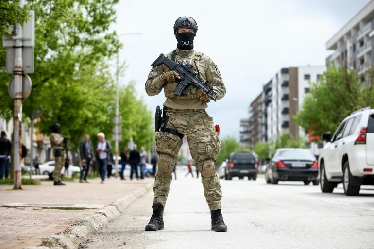 A member of the Special Anti-terrorist unit of police of Republika Srpska stands guard during the opening ceremony of the rectory building in Istocno Sarajevo, Bosnia, Thursday, April 24, 2025. (AP Photo/Armin Durgut)
