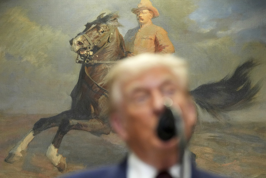 A portrait of President Theodore Roosevelt is seen as President Donald Trump speaks during an event to sign an executive order restarting the Presidential Fitness Test in public schools, Thursday, July 31, 2025, in the Roosevelt Room of the White House in Washington. (AP Photo/Jacquelyn Martin)
