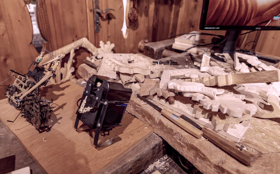 Cuckoo clock workshop with wooden pieces strewn over a workbench in the Black Forest, Germany