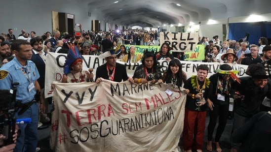 Indigenous activists participate in a protest at the COP30 U.N. Climate Summit, Friday, Nov. 21, 2025, in Belem, Brazil. (AP Photo/Andre Penner)(AP)