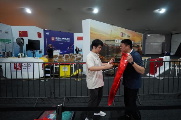 Members of the staff at the closed China Pavilion pack...