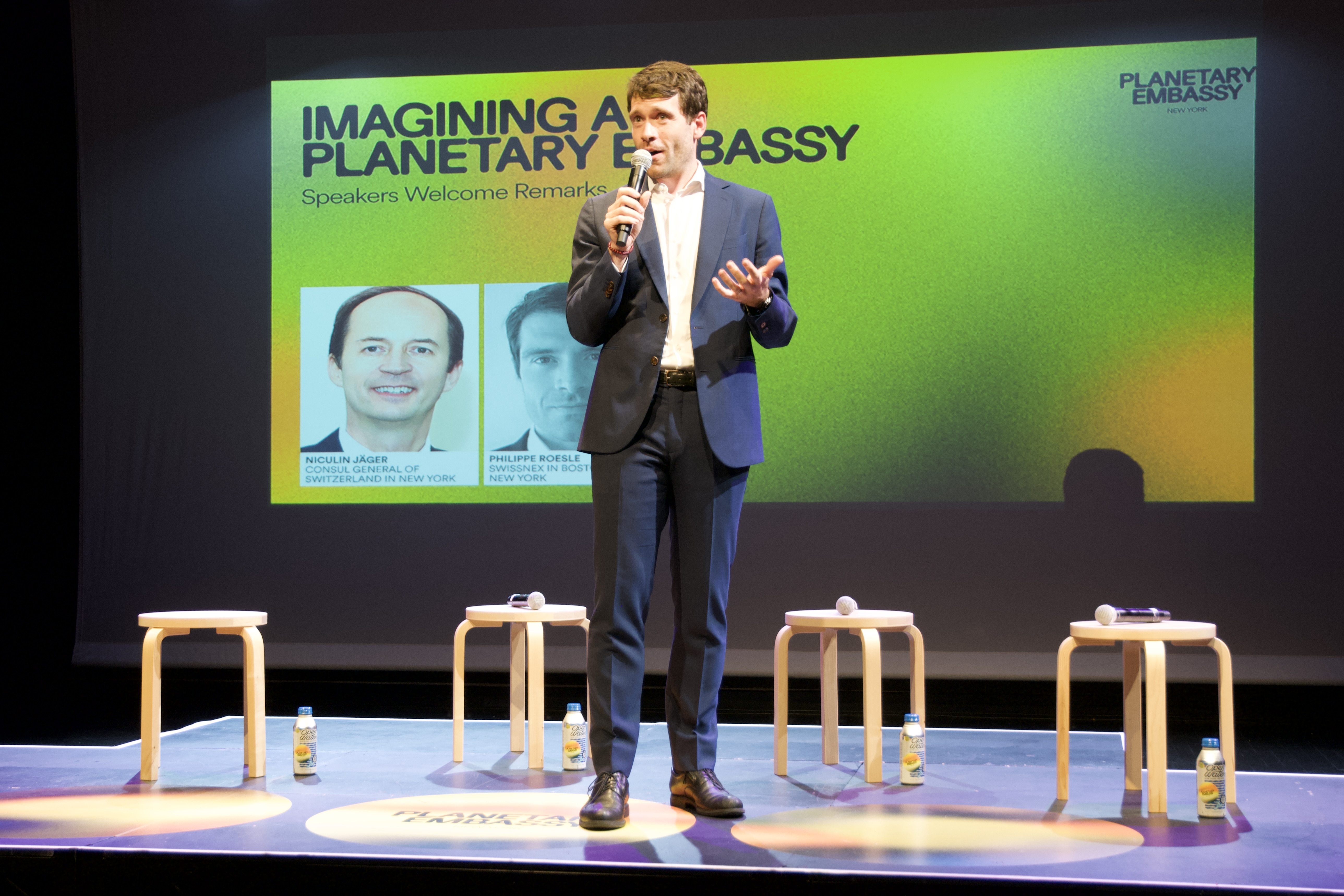 A man in a suit on stage