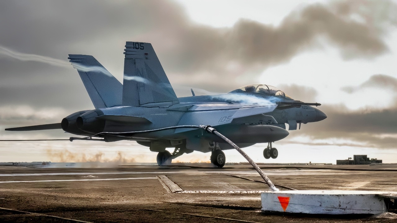 A U.S. Navy F/A-18F Super Hornet, assigned to the “Black Knights” of Strike Fighter Squadron (VFA) 154, lands on the flight deck of Nimitz-class aircraft carrier USS Theodore Roosevelt (CVN 71), July 24, 2025. Theodore Roosevelt, flagship of Carrier Strike Group (CSG) 9, is underway conducting exercises to bolster strike group readiness and capability in the U.S. 3rd Fleet area of operations. (U.S. Navy photo by Mass Communication Specialist 3rd Class Aaron Haro Gonzalez)