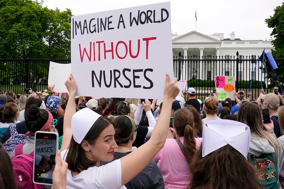 FILE - People protest outside the White House in Washington, May 12, 2022.