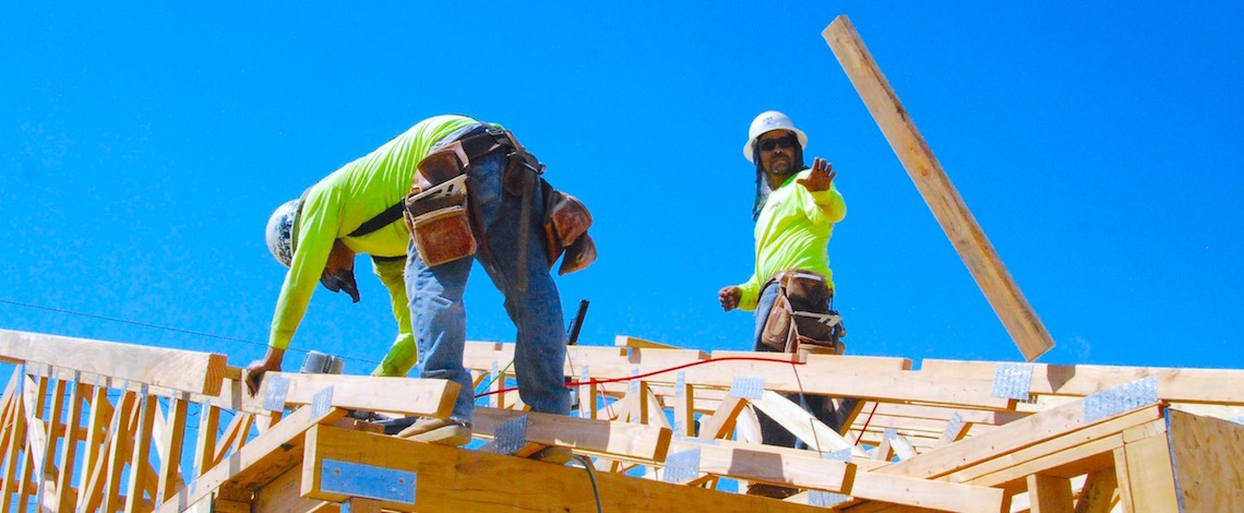 construction workers doing housing framing