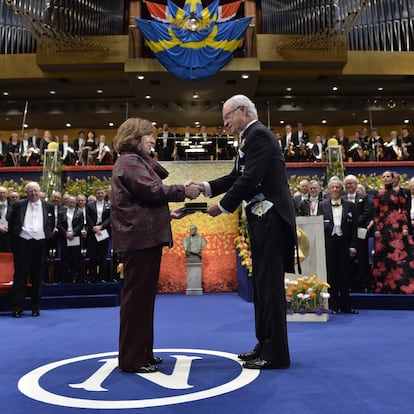 The 2015 Nobel literature laureate Svetlana Alexievich of Belarus receives the award from King Carl Gustaf of Sweden during the 2015 Nobel prize award ceremony at Stockholm Concert Hall on December 10, 2015